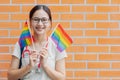 Happy medical people woman teen girl with LGBT rainbow pride month flag diversity campaign activity