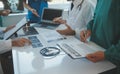 Happy medical team having a meeting in conference room in hospital. Doctors at briefing in hospital office Royalty Free Stock Photo