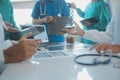 Happy medical team having a meeting in conference room in hospital. Doctors at briefing in hospital office Royalty Free Stock Photo