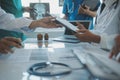 Happy medical team having a meeting in conference room in hospital. Doctors at briefing in hospital office Royalty Free Stock Photo