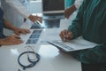 Happy medical team having a meeting in conference room in hospital. Doctors at briefing in hospital office Royalty Free Stock Photo