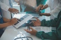 Happy medical team having a meeting in conference room in hospital. Doctors at briefing in hospital office Royalty Free Stock Photo