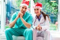 Happy medical team wearing Santa hats Royalty Free Stock Photo