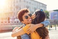 Two women hugging in town square Royalty Free Stock Photo