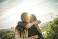 Happy meeting of two friends hugging at sunset outdoor - Pleasant moment of young sisters embracing in the wilderness Royalty Free Stock Photo