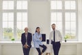 Happy members of diverse company staff gather together in modern spacious office Royalty Free Stock Photo