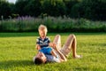 Happy father and son having fun outdoor on meadow Royalty Free Stock Photo