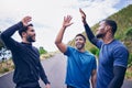 Happy, men and friends high five for fitness, workout and running outdoor with a smile. Exercise, training and sports Royalty Free Stock Photo