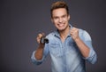 Happy men holding out car keys. Royalty Free Stock Photo