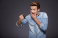 Happy men holding out car keys. Royalty Free Stock Photo