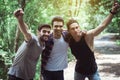 Happy man traveler friends hugging with hands raise up together at nature,Enjoying backpacking concept