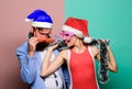 Happy man and woman wear santa hats and funny sunglasses. Cheerful couple celebrate new year. Corporate holiday party Royalty Free Stock Photo