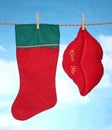 Happy Merry X mas Hanging christmas decoration hart and santa socks. Royalty Free Stock Photo