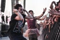 Happy metalheads under the stage