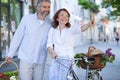 Happy mid adult married couple returning from groceries shopping Royalty Free Stock Photo