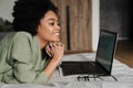 Happy young african woman using laptop computer Royalty Free Stock Photo