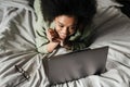 Happy young african woman using laptop computer Royalty Free Stock Photo