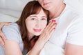 Happy middle age family couple in bed. White interior. Love and healthy relationships. Husband and wife portrait