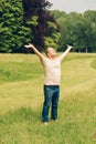 Happy middle age man enjoying nice day in summer park