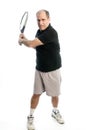 Happy middle age man playing tennis Royalty Free Stock Photo