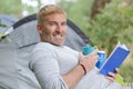 happy middle age man reading book outdoors Royalty Free Stock Photo