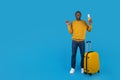 Happy black man having journey, pointing at copy space Royalty Free Stock Photo