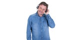 Happy middle aged businessman in headphones on white background with side copy space