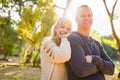 Smiling Middle Aged Caucasian Couple Portrait Outdoors