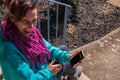 Happy middle aged caucasian woman smiling and looking up from her cellphone. The phone says winner on the screen. Royalty Free Stock Photo