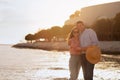 Happy Middle Aged Couple Embracing On The Beach At Sunset Royalty Free Stock Photo