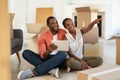 Mature black couple thinking furnishing new home Royalty Free Stock Photo