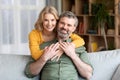 Happy Middle Aged Couple. Romantic Mature Man And Woman Hugging At Home Royalty Free Stock Photo