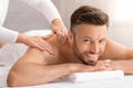 Happy middle aged man attending spa salon Royalty Free Stock Photo