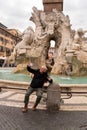 happy middle aged man on vacation taking a selfie in front of the fountain in piazza navona in rome Royalty Free Stock Photo