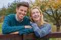 Happy Middle Aged Man Woman Couple Leaning on Fence in The Countryside Royalty Free Stock Photo