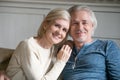 Happy middle aged romantic couple embracing at home, headshot po Royalty Free Stock Photo