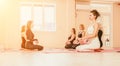 Happy middle aged well looking women, performing fascia exercises on floor using massage foam roller - tool to relieve Royalty Free Stock Photo