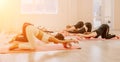 Happy middle aged well looking women, performing fascia exercises on floor using massage foam roller - tool to relieve Royalty Free Stock Photo