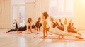 Happy middle aged well looking women, performing fascia exercises on floor using massage foam roller - tool to relieve Royalty Free Stock Photo