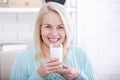 Happy middle aged woman drinking milk. Face close up. Royalty Free Stock Photo