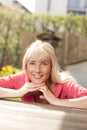 Happy middle aged woman in the garden Royalty Free Stock Photo