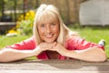 Happy middle aged woman in the garden Royalty Free Stock Photo