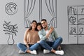 Happy middle eastern family posing at their new house, collage Royalty Free Stock Photo