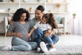 Happy middle eastern family posing together, waiting for baby Royalty Free Stock Photo