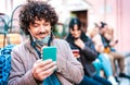 Happy millenial guy smiling over open face mask after lockdown reopening