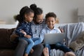 Happy millennial African father hugging, holding son in arms Royalty Free Stock Photo