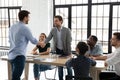 Happy millennial business team welcoming new employee Royalty Free Stock Photo