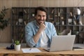 Happy millennial businessman looking at camera, posing in modern office. Royalty Free Stock Photo