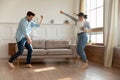 Overjoyed young coupe dance at home on weekend