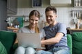 Happy couple laughing looking at laptop together watching funny Royalty Free Stock Photo
